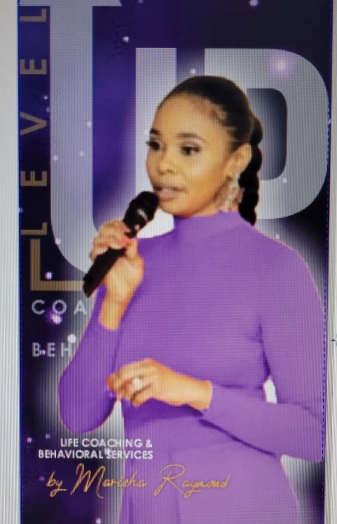 A woman in purple is holding a microphone